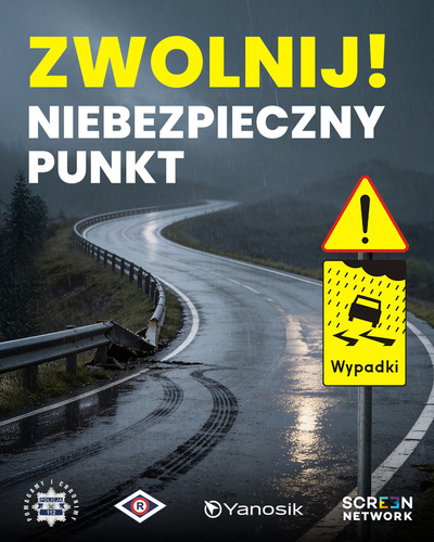 "Plakat informacyjny z napisem: Zwolnij! Niebezpieczny punkt. W tle kręta droga."